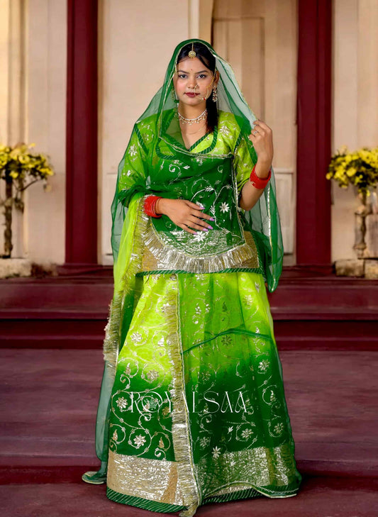 Woman wearing green Rajputi Poshak with silver gota patti work and traditional jewelry – Royalsaa festive ethnic wear